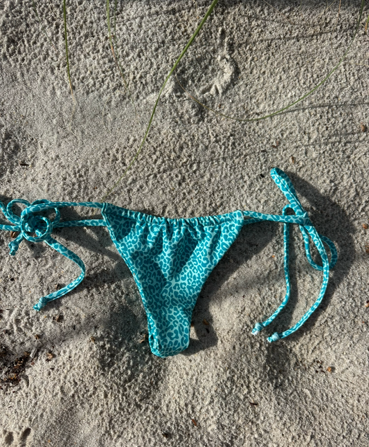 Turquoise cheetah slide bottoms